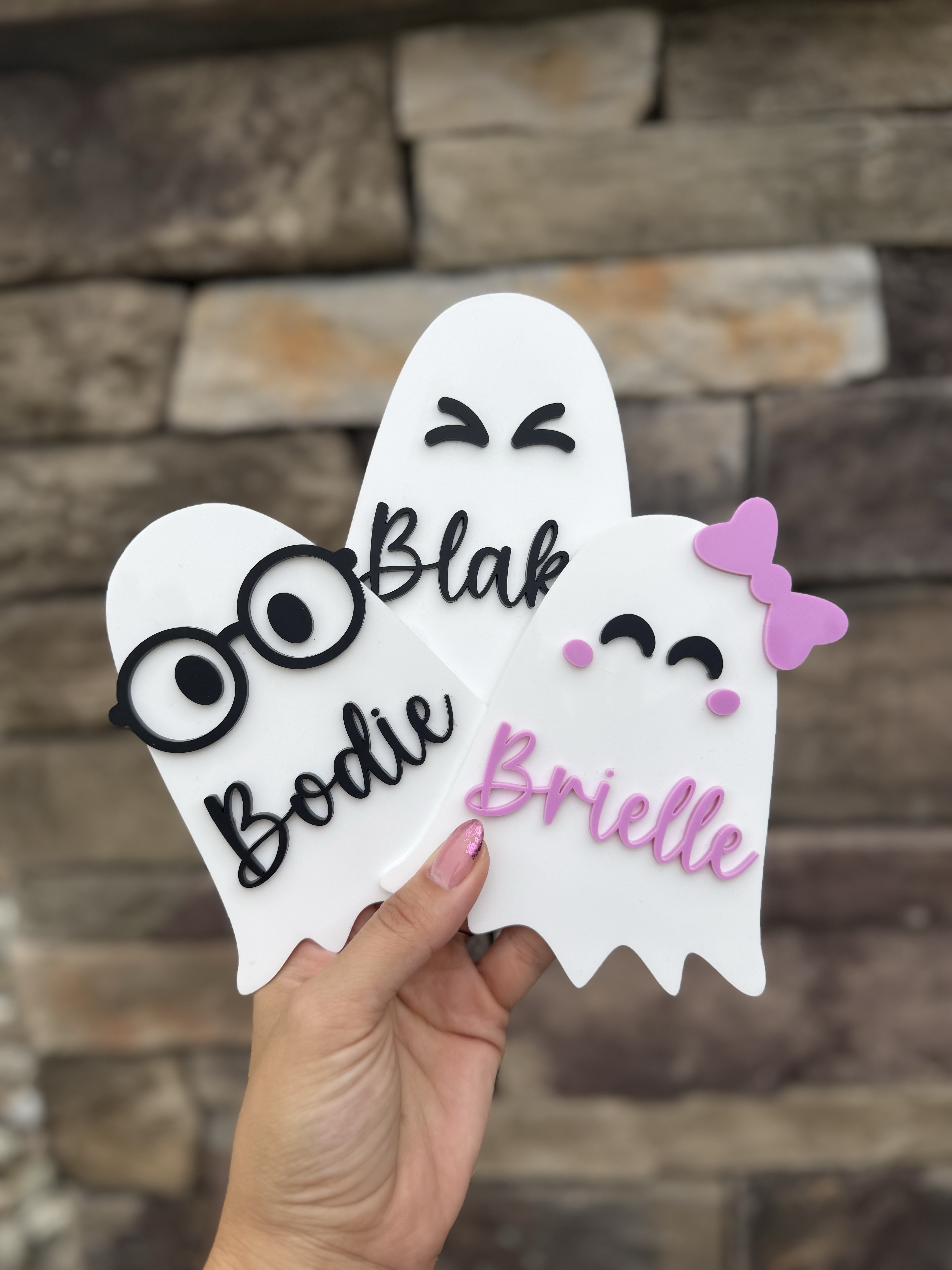 Three personalized ghost-shaped Boo Bag name tags for Blake, Bodie, and Brielle