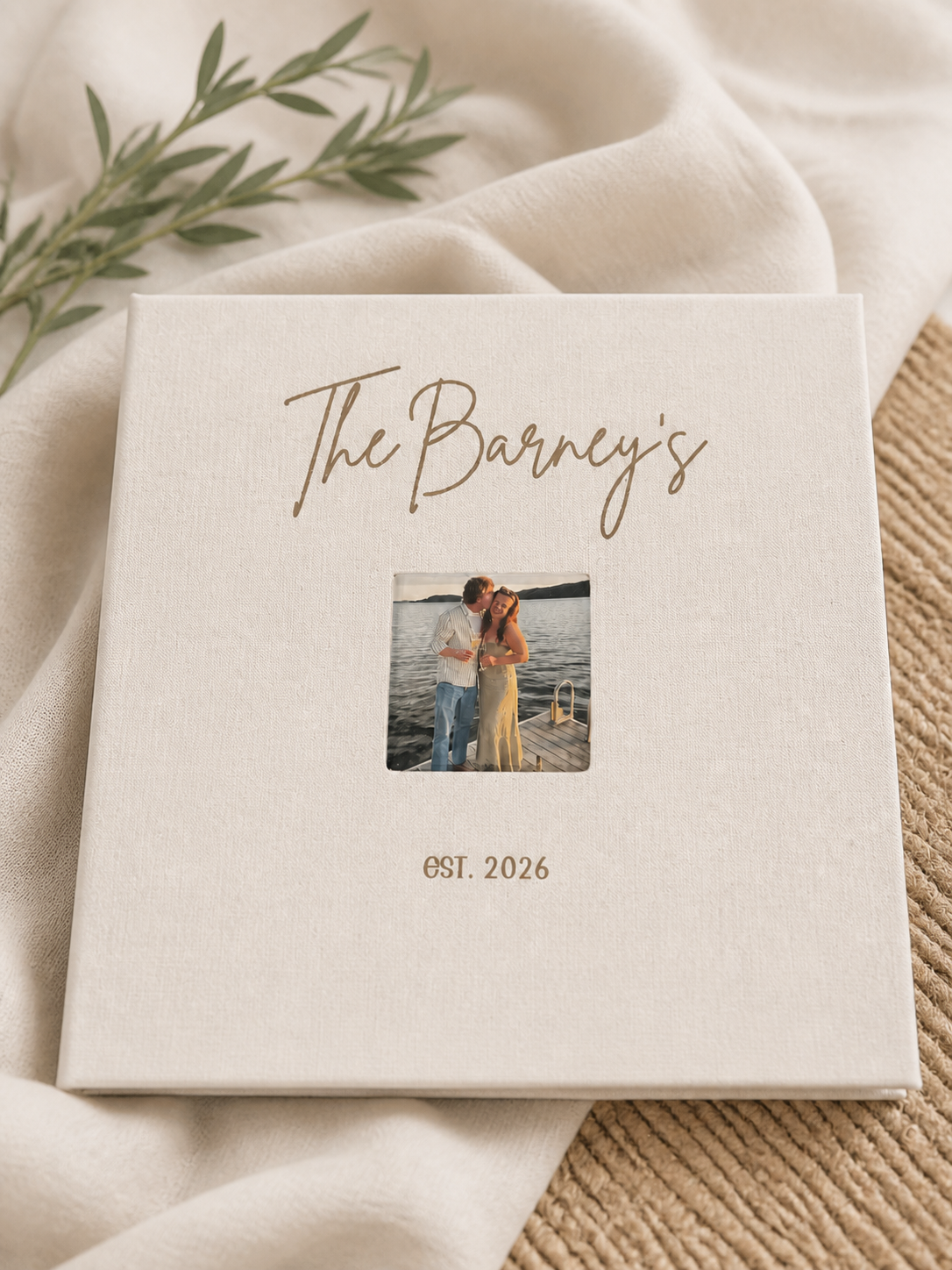 Ivory engraved photo album personalized for The Barney's and styled on soft organic linen