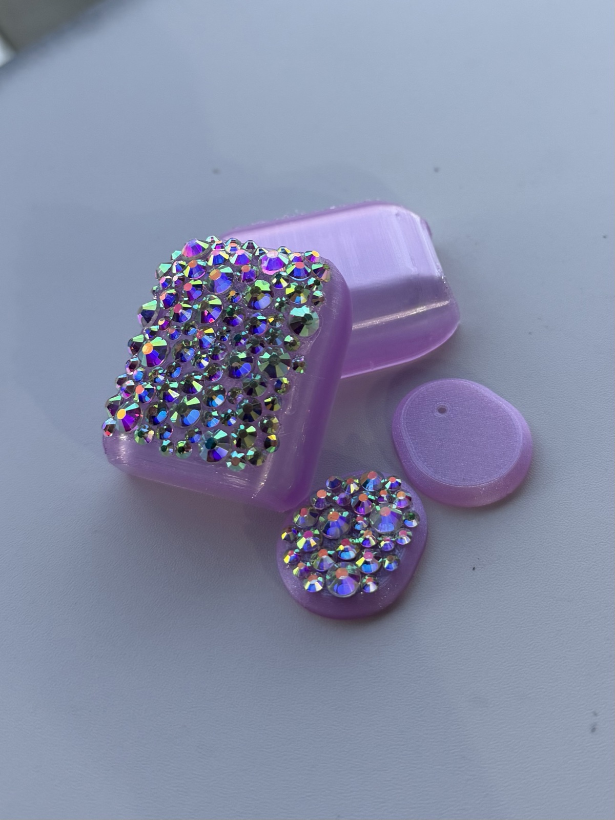 Lavender medical device covers decorated with iridescent rhinestones