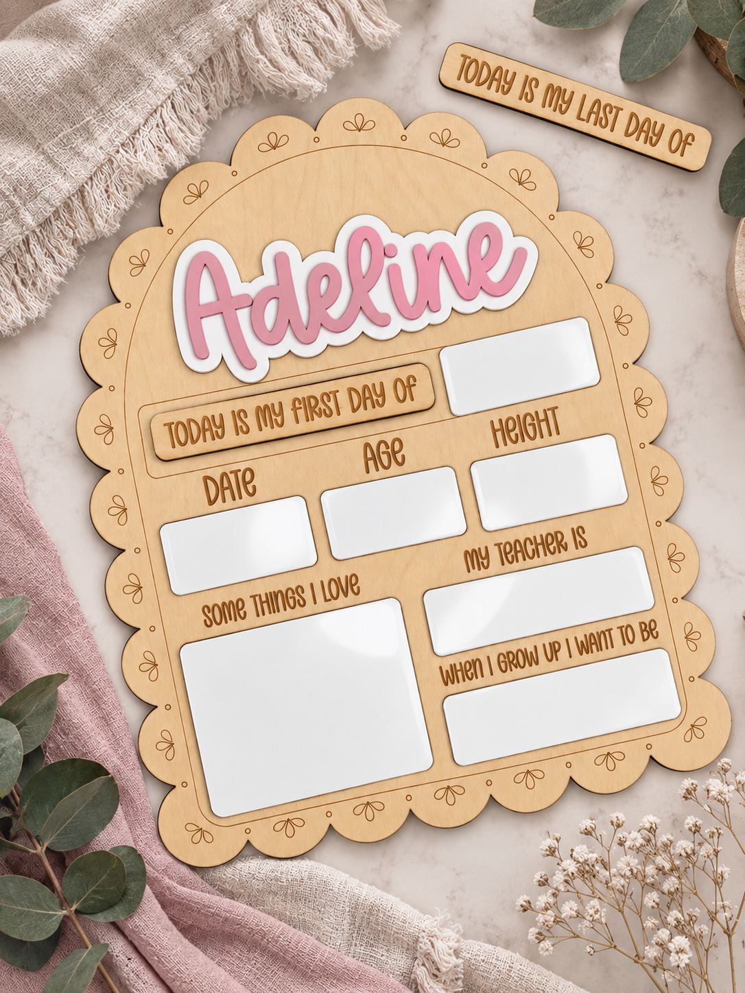 Personalized scalloped wooden school sign with pink Adeline lettering and spaces for school-day milestones